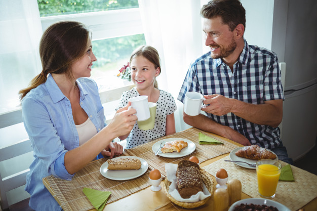 family-toasting-cup-coffee-while-having-breakfast_107420-39424.jpg